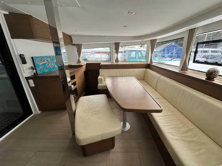 Vela Yacht Photos Pics Interior of 2018 Lagoon 42 catamaran with spacious seating and dining area.