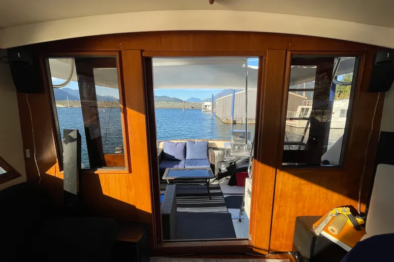 Hasta La Vista Yacht Photos Pics Interior view of 1997 Symbol 48 Sportfish yacht with waterfront scenery.