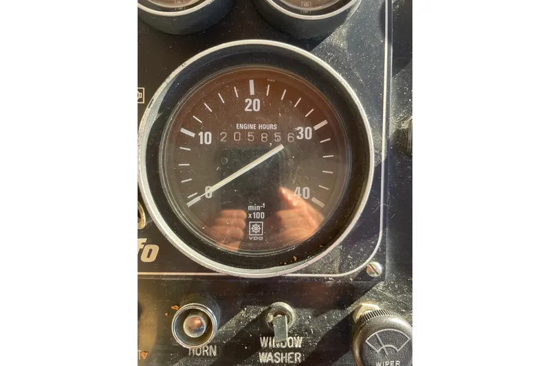 Hasta La Vista Yacht Photos Pics Close-up of a 1997 Symbol 48 Sportfish engine hour gauge displaying 2058.6 hours.