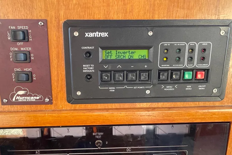 Hasta La Vista Yacht Photos Pics Control panel of a 1997 Symbol 48 Sportfish boat with Xantrex inverter display.