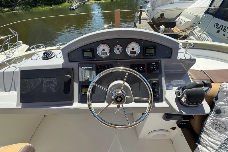  Yacht Photos Pics Helm of 2018 Beneteau Swift Trawler 44 with navigational controls and steering wheel.