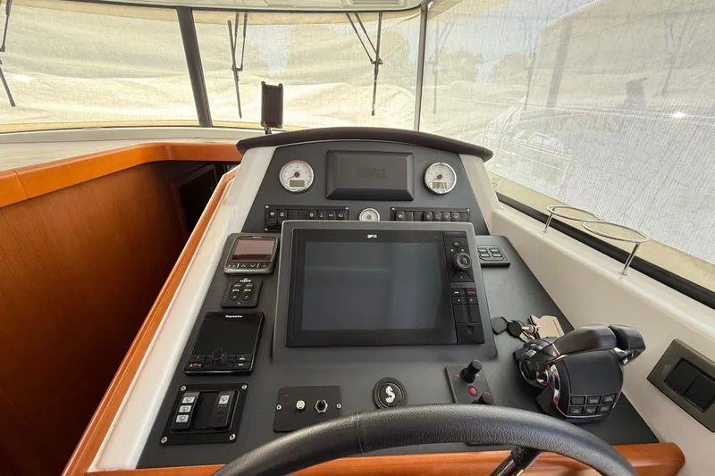  Yacht Photos Pics Cockpit of 2018 Beneteau Swift Trawler 44 with navigation equipment and controls.