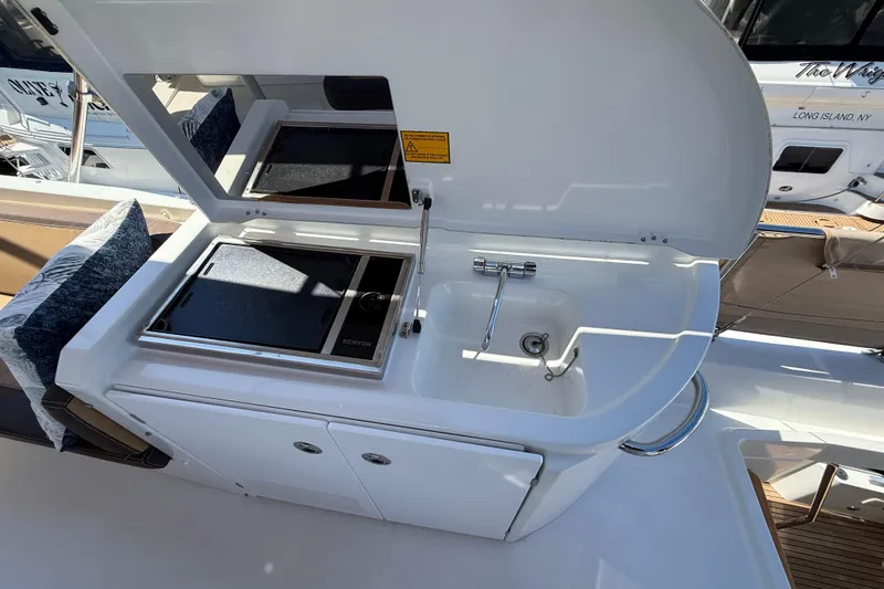  Yacht Photos Pics Outdoor kitchen on 2018 Beneteau Swift Trawler 44 with sink and grill.