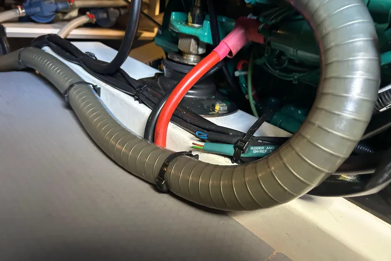  Yacht Photos Pics Engine compartment of 2018 Beneteau Swift Trawler 44 with visible wiring and hoses.