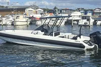2022 Iron 827 T-Top boat docked in marina, surrounded by other vessels.