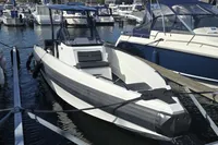 2022 Iron 827 T-Top boat docked at marina, surrounded by other vessels.