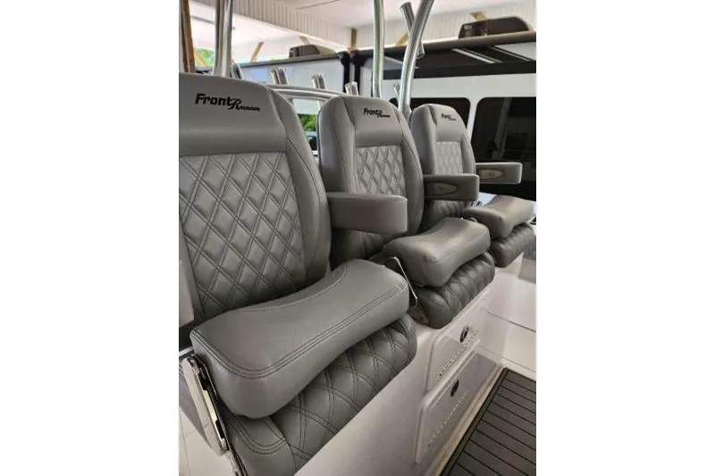  Yacht Photos Pics 2023 Front Runner 36 cc boat seats with gray diamond-stitched upholstery and armrests.