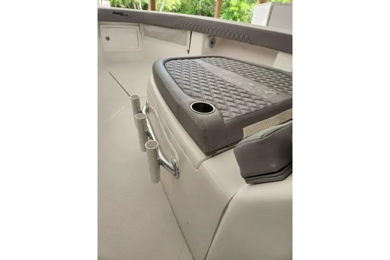  Yacht Photos Pics 2023 Front Runner 36 cc boat interior with cushioned seating and cup holders.