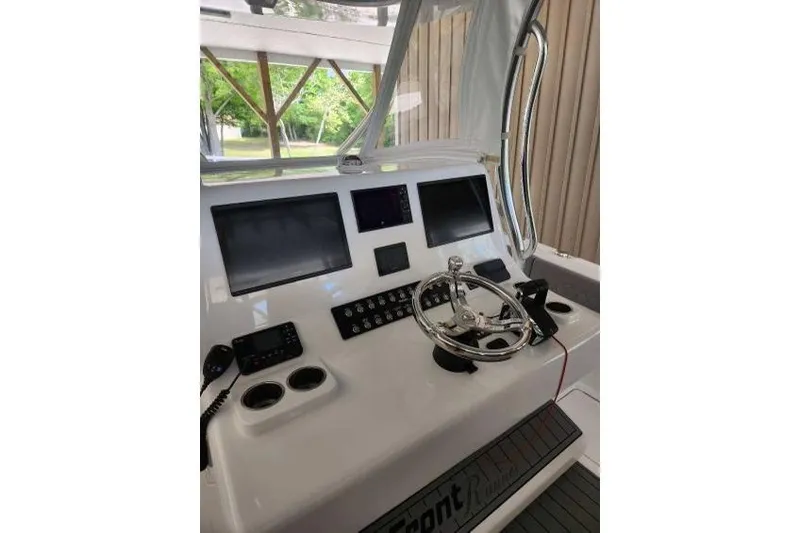  Yacht Photos Pics 2023 Front Runner 36 cc boat dashboard with steering wheel and electronic displays.