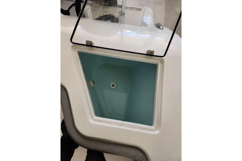  Yacht Photos Pics 2023 Front Runner 36 cc boat livewell with open lid, showcasing interior design.