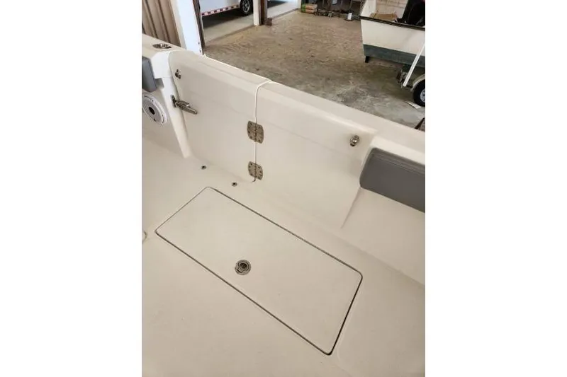  Yacht Photos Pics 2023 Front Runner 36 cc boat interior with storage compartment and hinges.