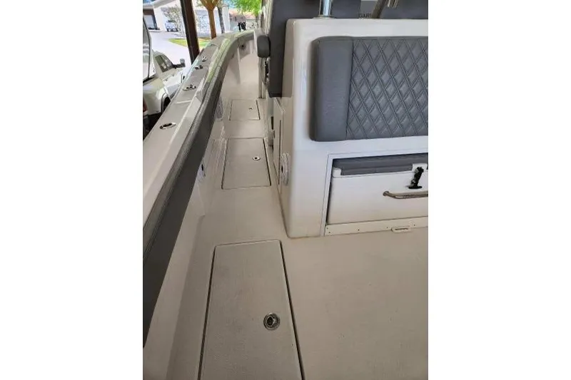  Yacht Photos Pics 2023 Front Runner 36 cc boat interior with cushioned seating and storage compartments.