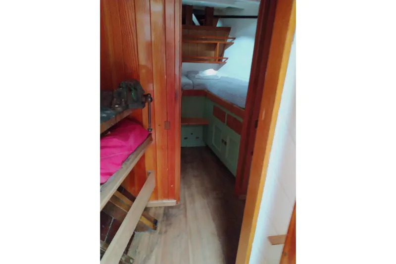 Martha Primrose Yacht Photos Pics Cozy cabin interior of 2012 Custom Mayflower 50 boat with wooden furnishings.