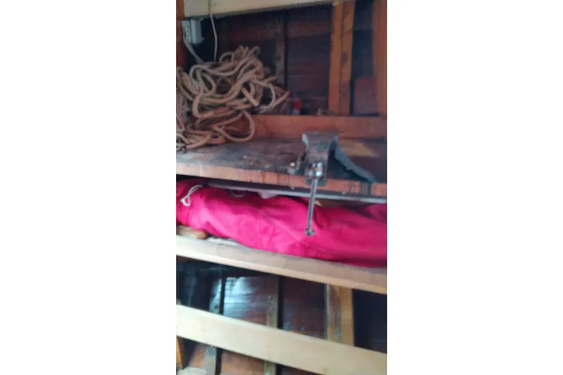 Martha Primrose Yacht Photos Pics Workshop shelf with coiled rope, red fabric, and a vise on a Custom Mayflower 50, 2012.