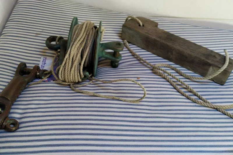 Martha Primrose Yacht Photos Pics Vintage nautical equipment with ropes on striped fabric, Custom Mayflower 50, 2012.