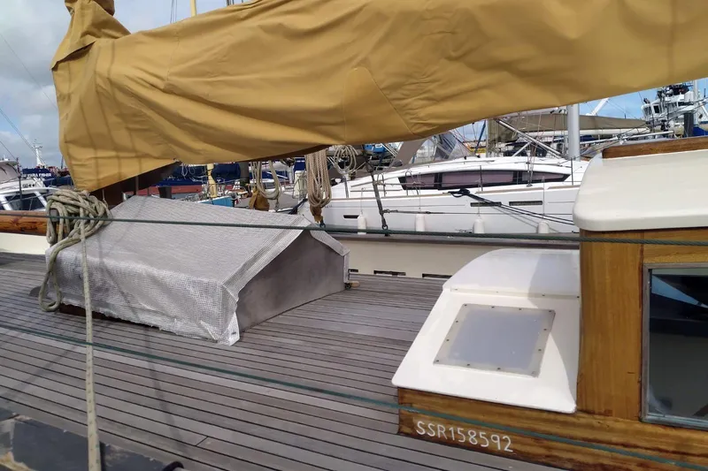 Martha Primrose Yacht Photos Pics Sailboat deck of Custom Mayflower 50, 2012 model, with covered mast and docked yachts.