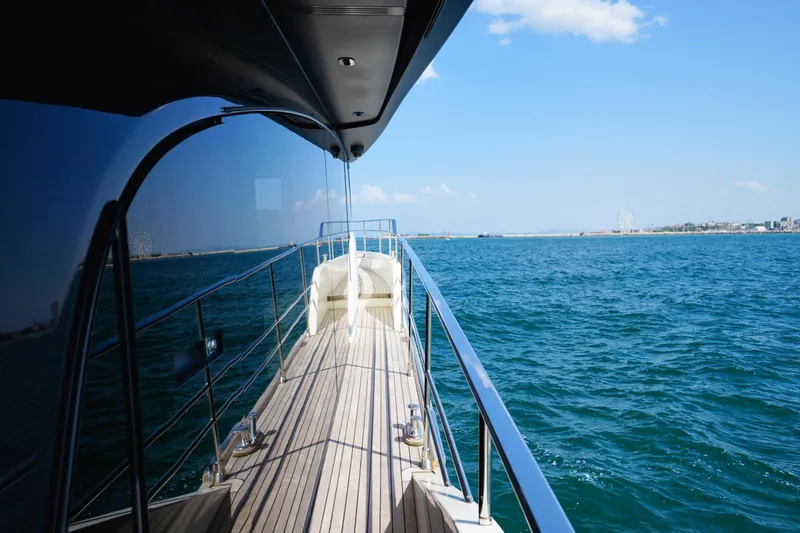 Amy Yacht Photos Pics 2023 Cranchi Sessantasette 67 yacht deck with ocean view and clear blue sky.