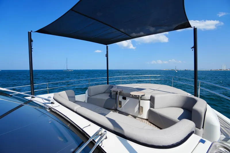 Amy Yacht Photos Pics Luxurious 2023 Cranchi Sessantasette 67 yacht deck with elegant seating and ocean view.