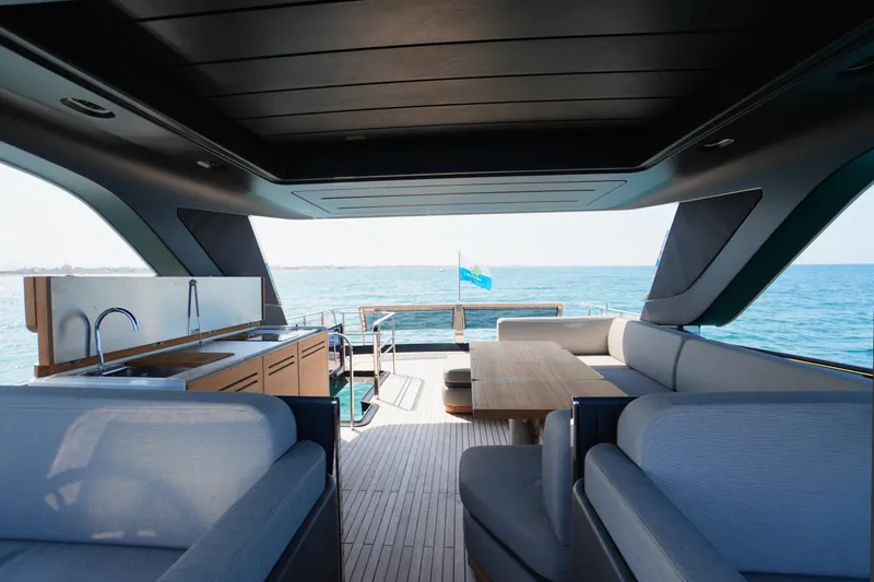 Amy Yacht Photos Pics Luxurious 2023 Cranchi Sessantasette 67 yacht interior with ocean view and modern seating.