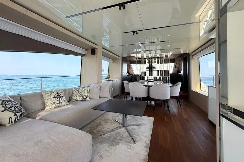 Amy Yacht Photos Pics Luxurious interior of 2023 Cranchi Sessantasette 67 yacht with elegant seating and ocean view.