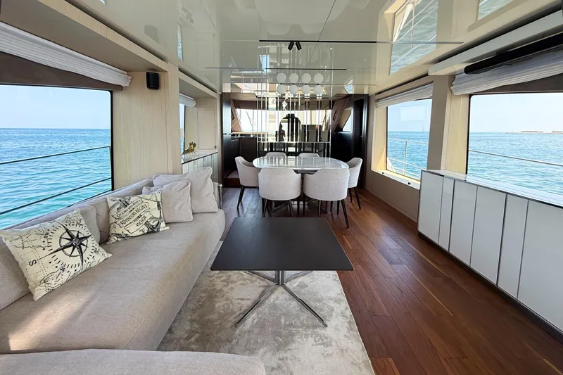 Amy Yacht Photos Pics Luxurious interior of 2023 Cranchi Sessantasette 67 yacht with ocean view and elegant furnishings.