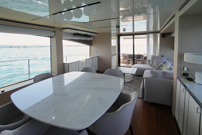 Amy Yacht Photos Pics Luxurious interior of 2023 Cranchi Sessantasette 67 yacht with elegant dining and lounge area.