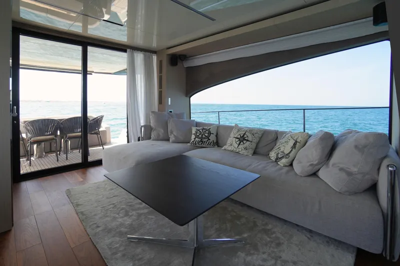 Amy Yacht Photos Pics Luxurious interior of 2023 Cranchi Sessantasette 67 yacht with ocean view and modern furnishings.