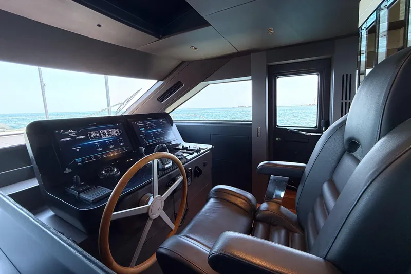 Amy Yacht Photos Pics 2023 Cranchi Sessantasette 67 yacht helm with leather seating and ocean view.