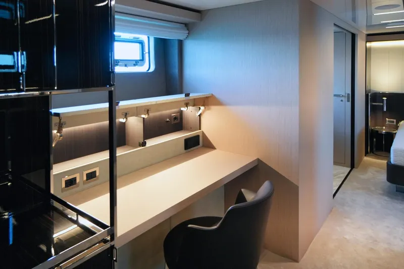 Amy Yacht Photos Pics Luxurious interior of 2023 Cranchi Sessantasette 67 yacht with modern desk and chair.