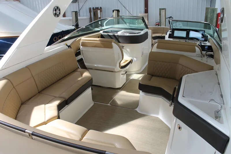  Yacht Photos Pics 2023 Sea Ray SLX 310 Outboard interior with luxurious seating and modern design.