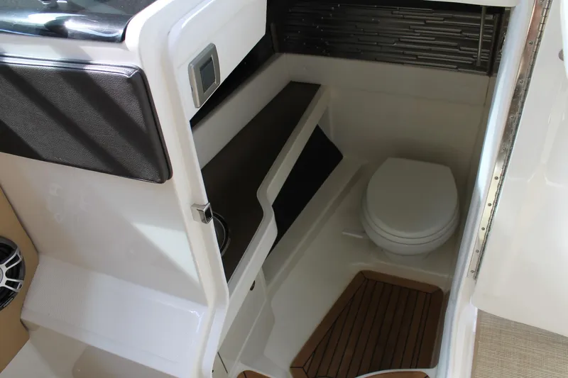  Yacht Photos Pics 2023 Sea Ray SLX 310 Outboard boat interior with compact bathroom and toilet.