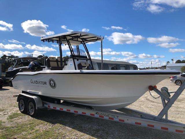 2024 Reflex Gladiator boat on trailer under blue sky.