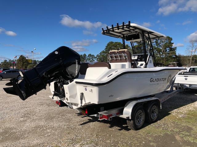 2024 Reflex Gladiator boat on trailer, parked outdoors under blue sky.