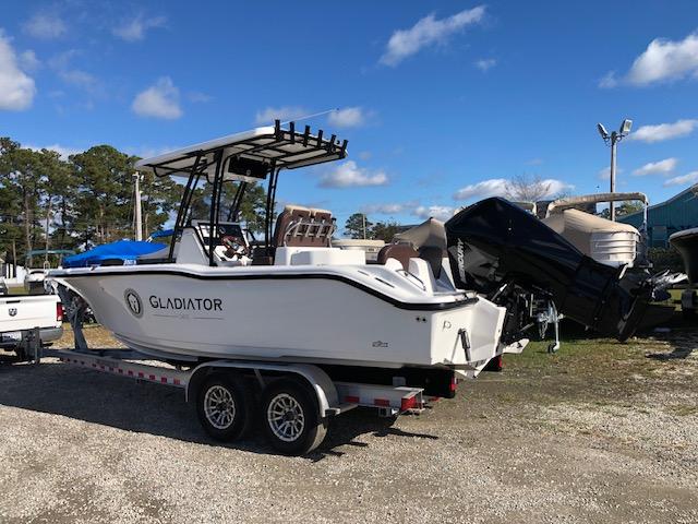 2024 Reflex Gladiator boat on trailer under clear blue sky.