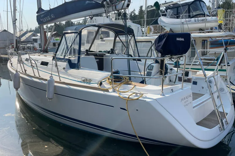 Jaacktak Yacht Photos Pics 2004 Dufour 40 Performance sailboat docked in a marina, featuring sleek design and modern equipment.