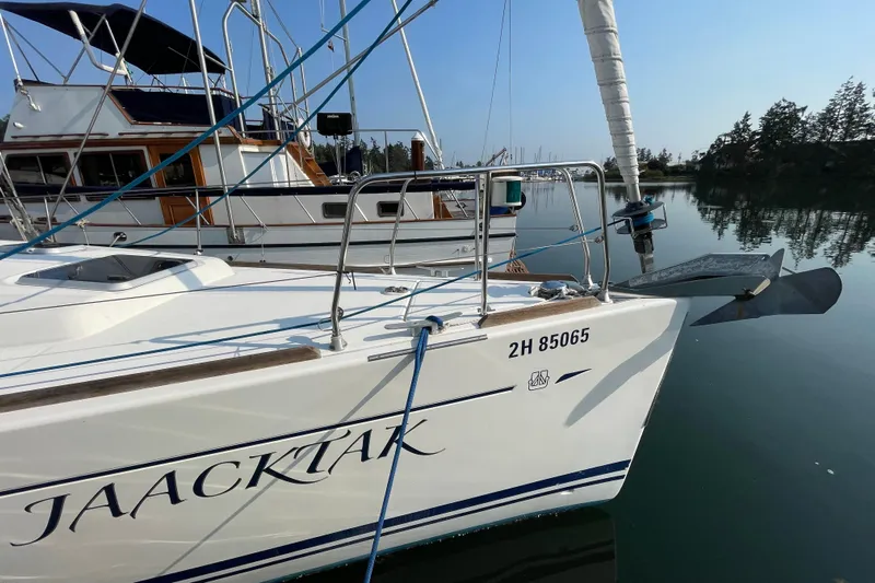 Jaacktak Yacht Photos Pics Sailboat Dufour 40 Performance 2004 docked in calm marina waters.