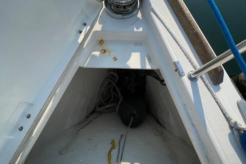 Jaacktak Yacht Photos Pics Anchor locker of 2004 Dufour 40 Performance sailboat with ropes and fender.