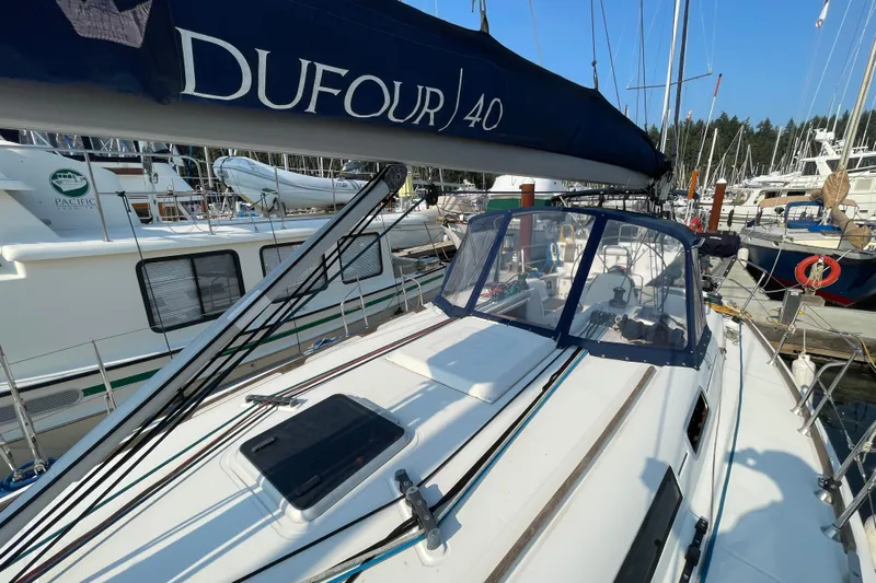 Jaacktak Yacht Photos Pics 2004 Dufour 40 Performance sailboat docked at marina, featuring sleek design and spacious cockpit.
