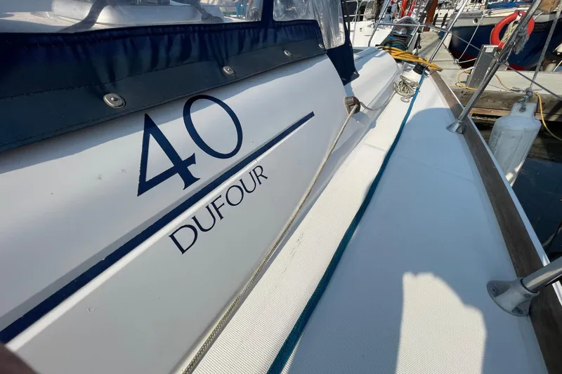 Jaacktak Yacht Photos Pics Dufour 40 Performance sailboat, 2004 model, docked with visible deck and branding.