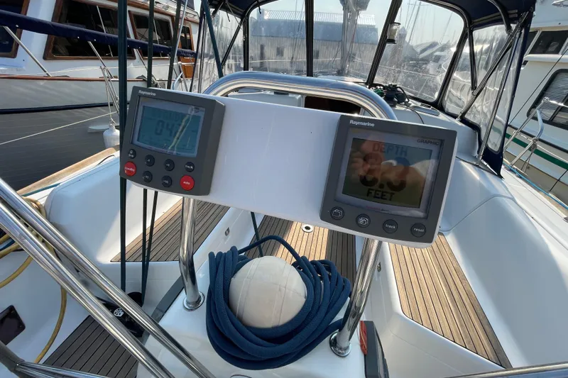 Jaacktak Yacht Photos Pics Cockpit of 2004 Dufour 40 Performance sailboat with navigation instruments and coiled rope.