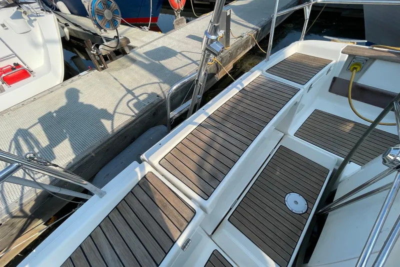 Jaacktak Yacht Photos Pics Dufour 40 Performance 2004 yacht with wooden deck, docked at marina.