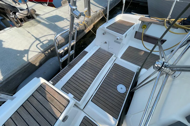 Jaacktak Yacht Photos Pics 2004 Dufour 40 Performance yacht deck with teak flooring and stainless steel fittings.