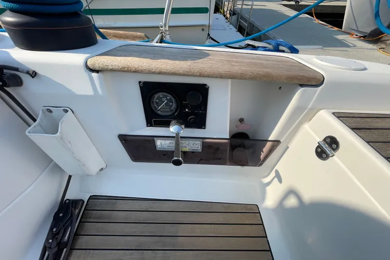 Jaacktak Yacht Photos Pics Cockpit controls of 2004 Dufour 40 Performance sailboat with wooden accents and gauges.