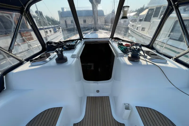 Jaacktak Yacht Photos Pics Cockpit view of 2004 Dufour 40 Performance sailboat, featuring winches and teak flooring.