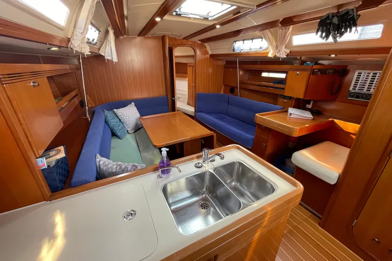 Jaacktak Yacht Photos Pics Interior of 2004 Dufour 40 Performance yacht with cozy seating and modern kitchen area.