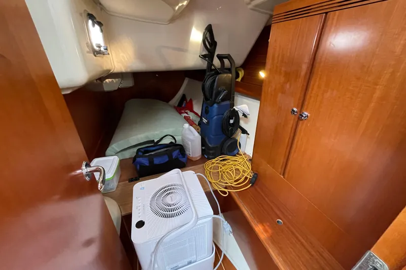 Jaacktak Yacht Photos Pics Cozy cabin interior of 2004 Dufour 40 Performance yacht with storage and equipment.