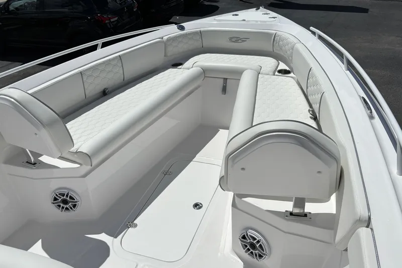  Yacht Photos Pics 2026 Glasstream 280 Pro-XS boat interior with white cushioned seating and speaker system.