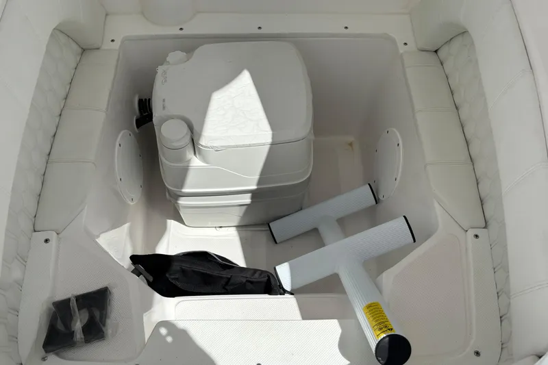  Yacht Photos Pics 2026 Glasstream 280 Pro-XS boat storage area with portable toilet and accessories.