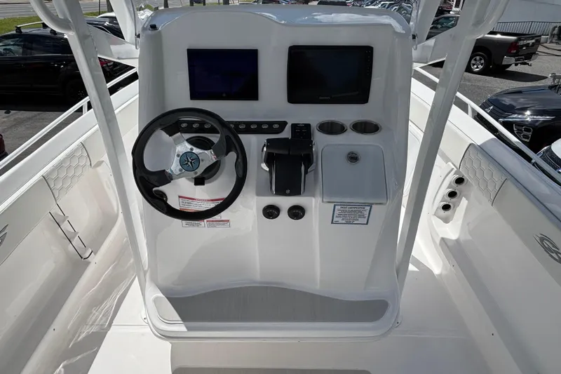  Yacht Photos Pics 2026 Glasstream 280 Pro-XS boat dashboard with steering wheel and dual displays.