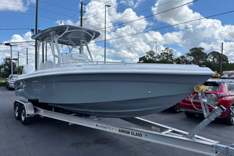  Yacht Photos Pics 2026 Glasstream 280 Pro-XS boat on trailer under cloudy sky.